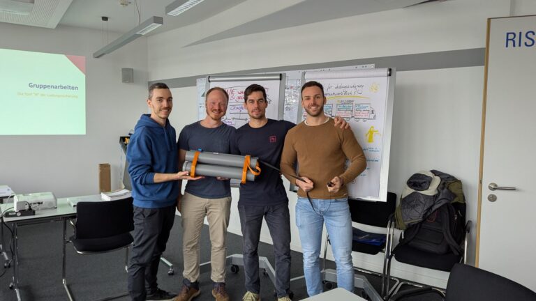 Vier IfG-Berater auf einem Gruppenbild während der Fortbildung